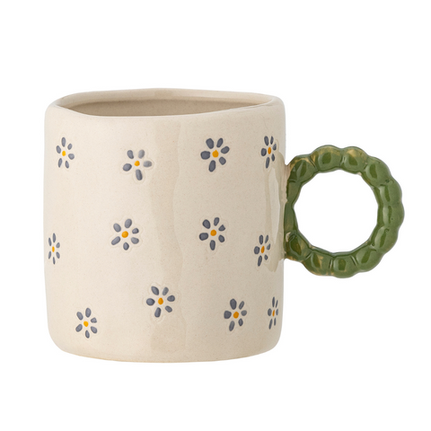 Tasse beige avec des fleurs inside déco