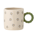 Tasse beige avec des fleurs inside déco 